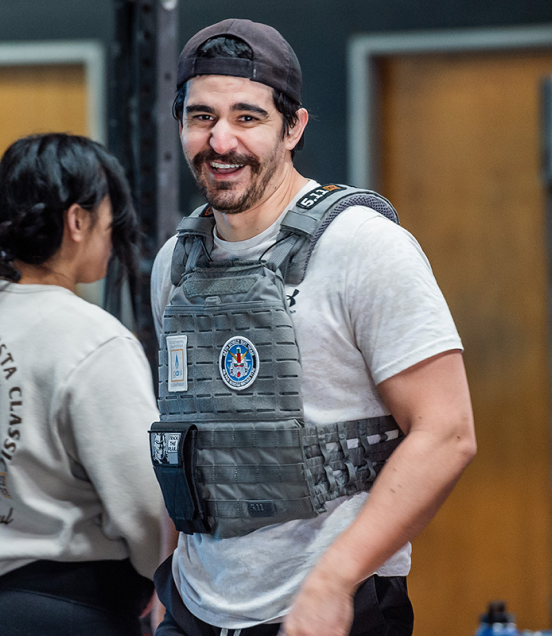 crossfit gym member with vest